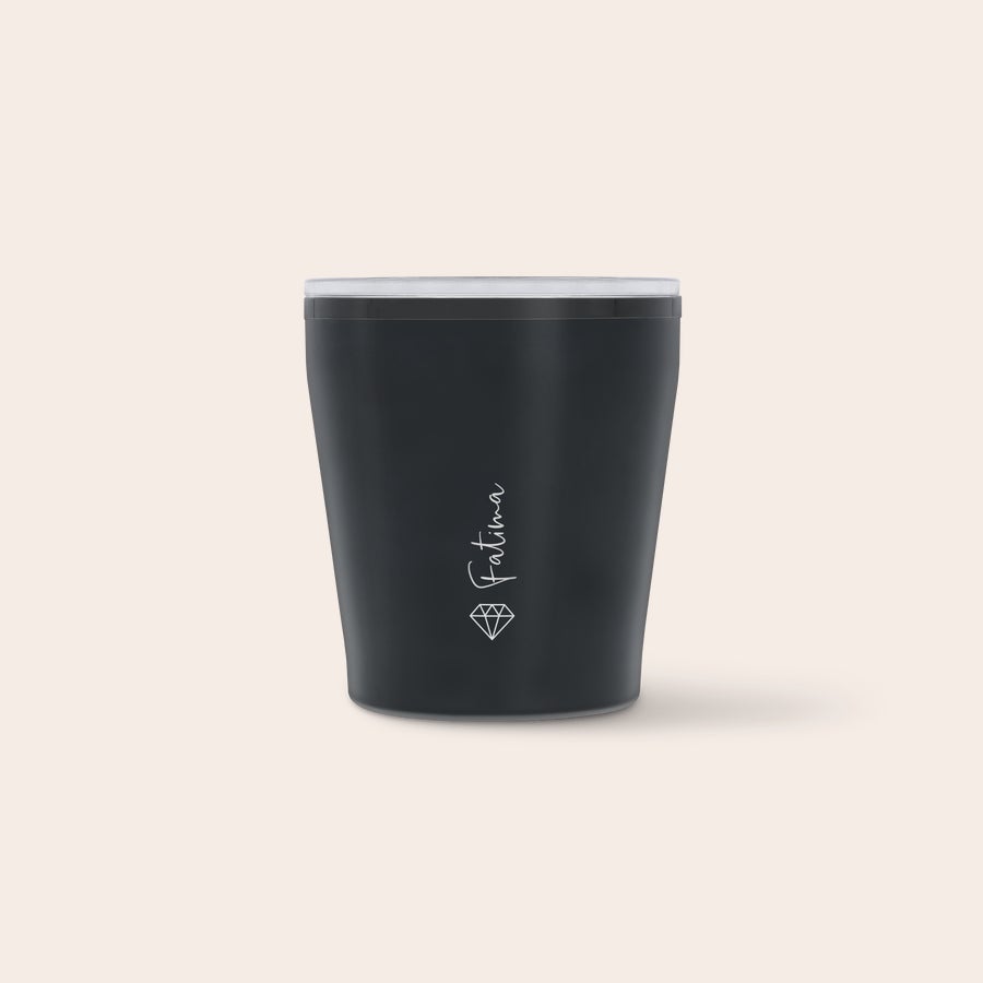 Engraved travel mug A dark grey personalised travel mug with a clear lid, printed with the name Fatima and a diamond graphic, for sipping in style while on the go.