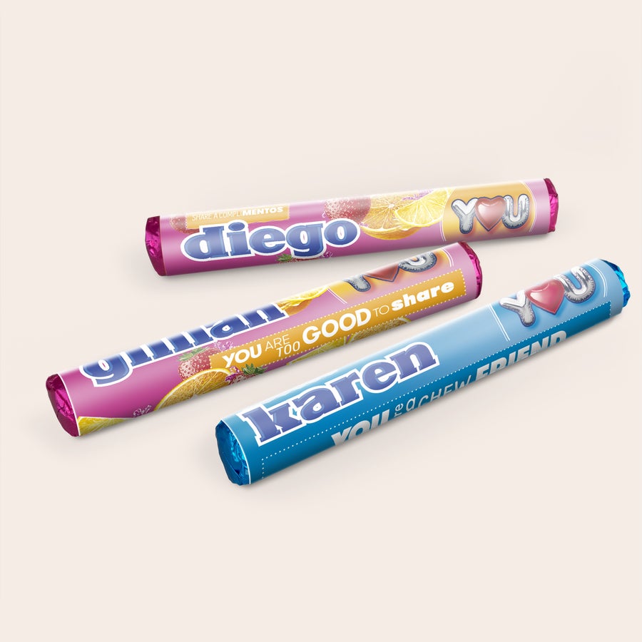 Three personalized Mentos rolls printed with names like Diego and Karen, making a sweet personalized gift.