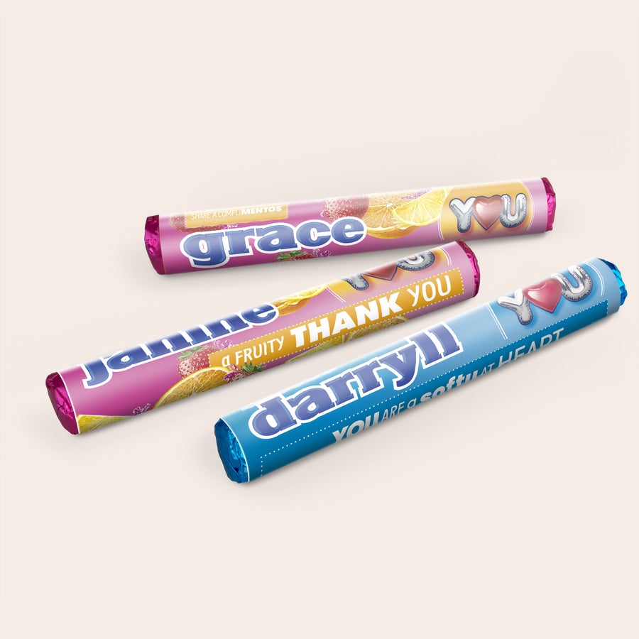 Three personalized Mentos rolls, printed with names like Grace, Janine, and Darryll, and messages like Thank You.