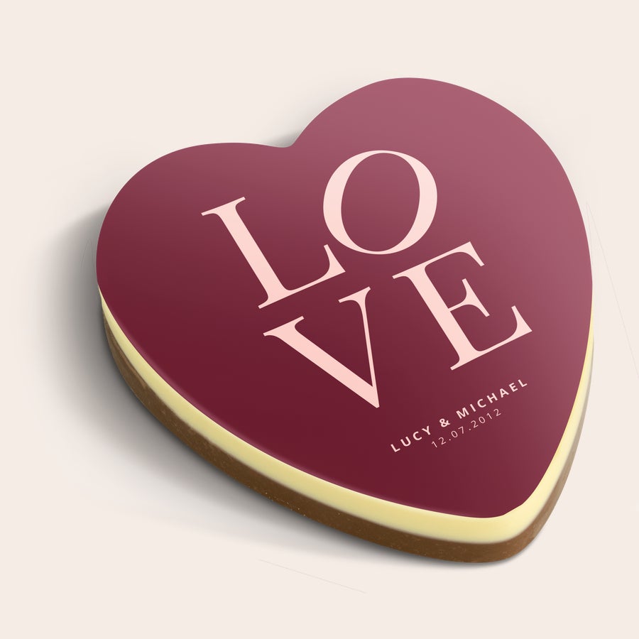 Personalised chocolate heart Personalized chocolate heart with "LOVE" printed in large letters and custom names and a date on a maroon background