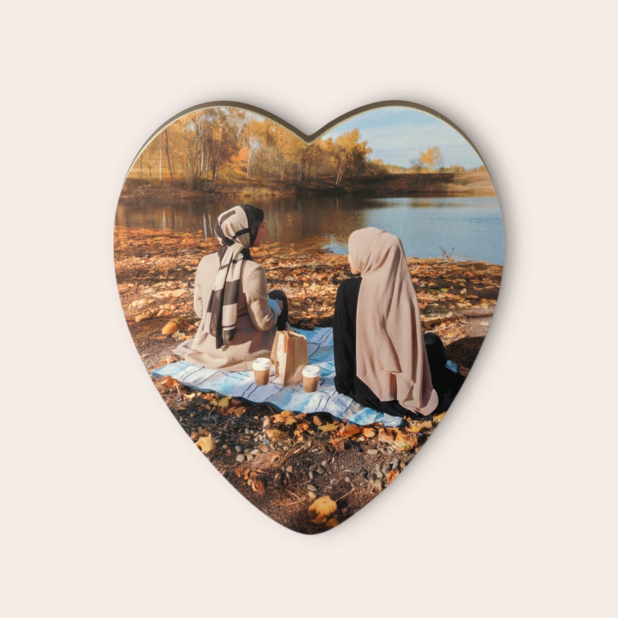 Personalised chocolate heart Personalized chocolate heart with a printed photo of two women having a picnic by a lake.