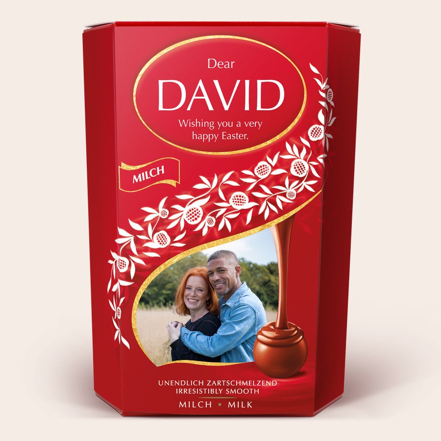 Red Lindt Chocolate Gift Box with a photo of a couple and personalized text wishing David a Happy Easter. This Lindt Chocolate Gift Box is the perfect gift for chocoholics.