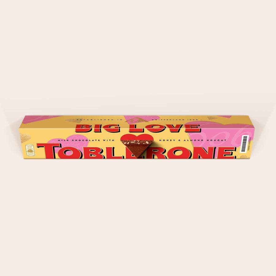 Personalized Toblerone bar with Big Love design, a photo of a chocolate triangle, and custom name and photo printed on the wrapper